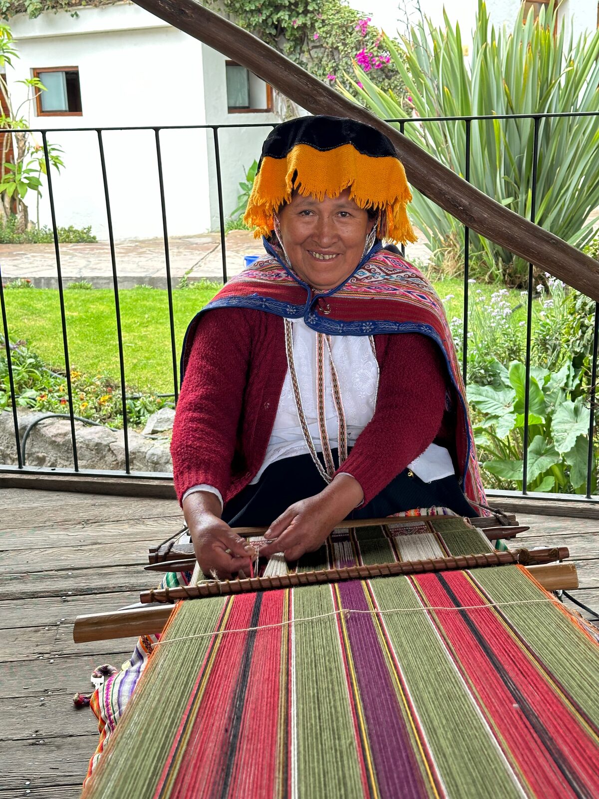 Andean artisan weaving alpaca on a traditional backstrap loom