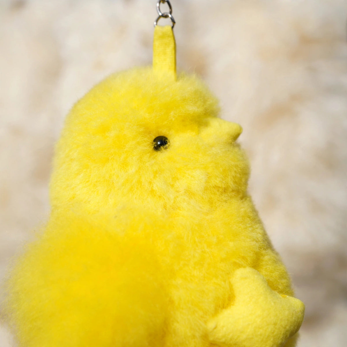 Close-up of soft real alpaca fur on the chick keychain