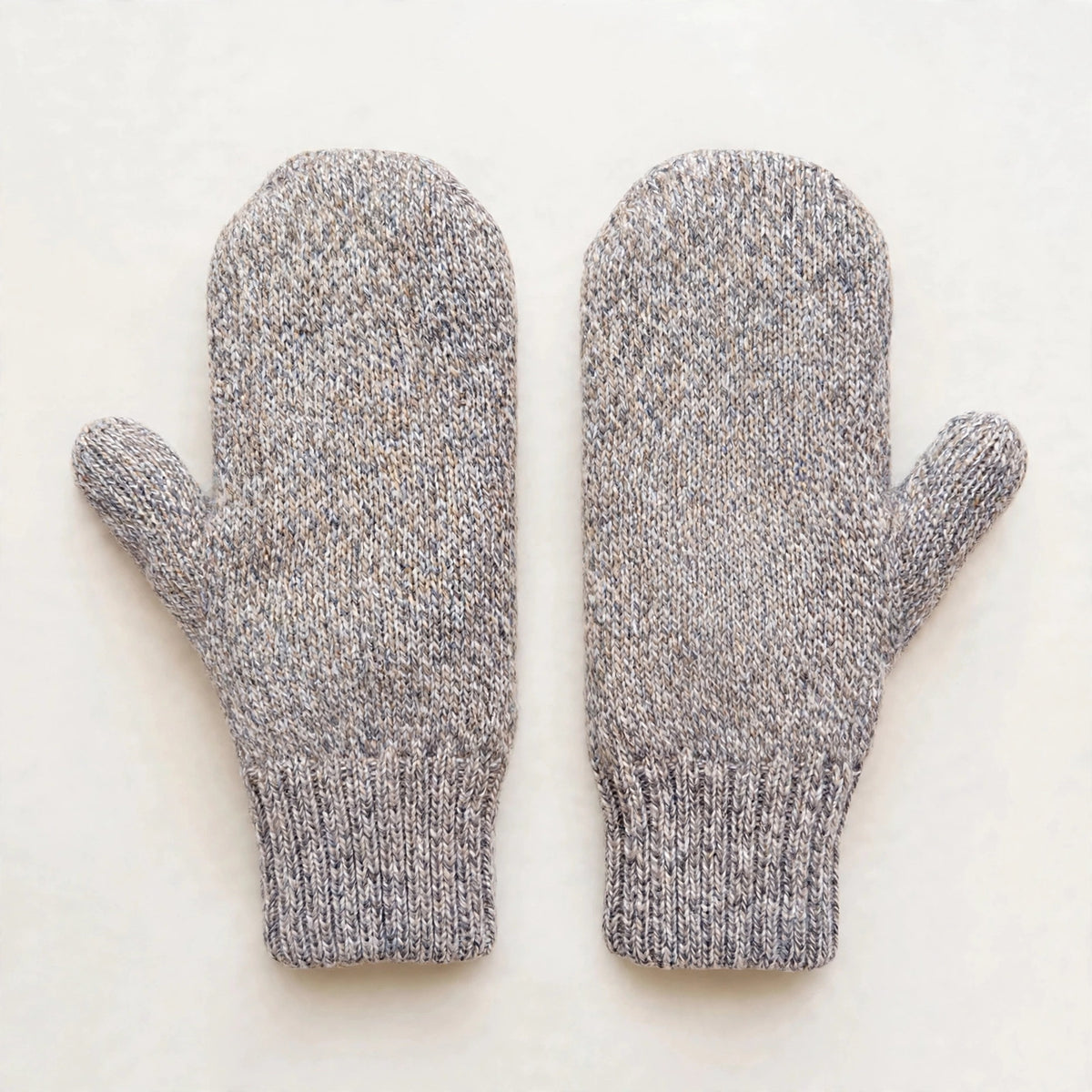 Reversible alpaca mittens turned to the solid heather grey side