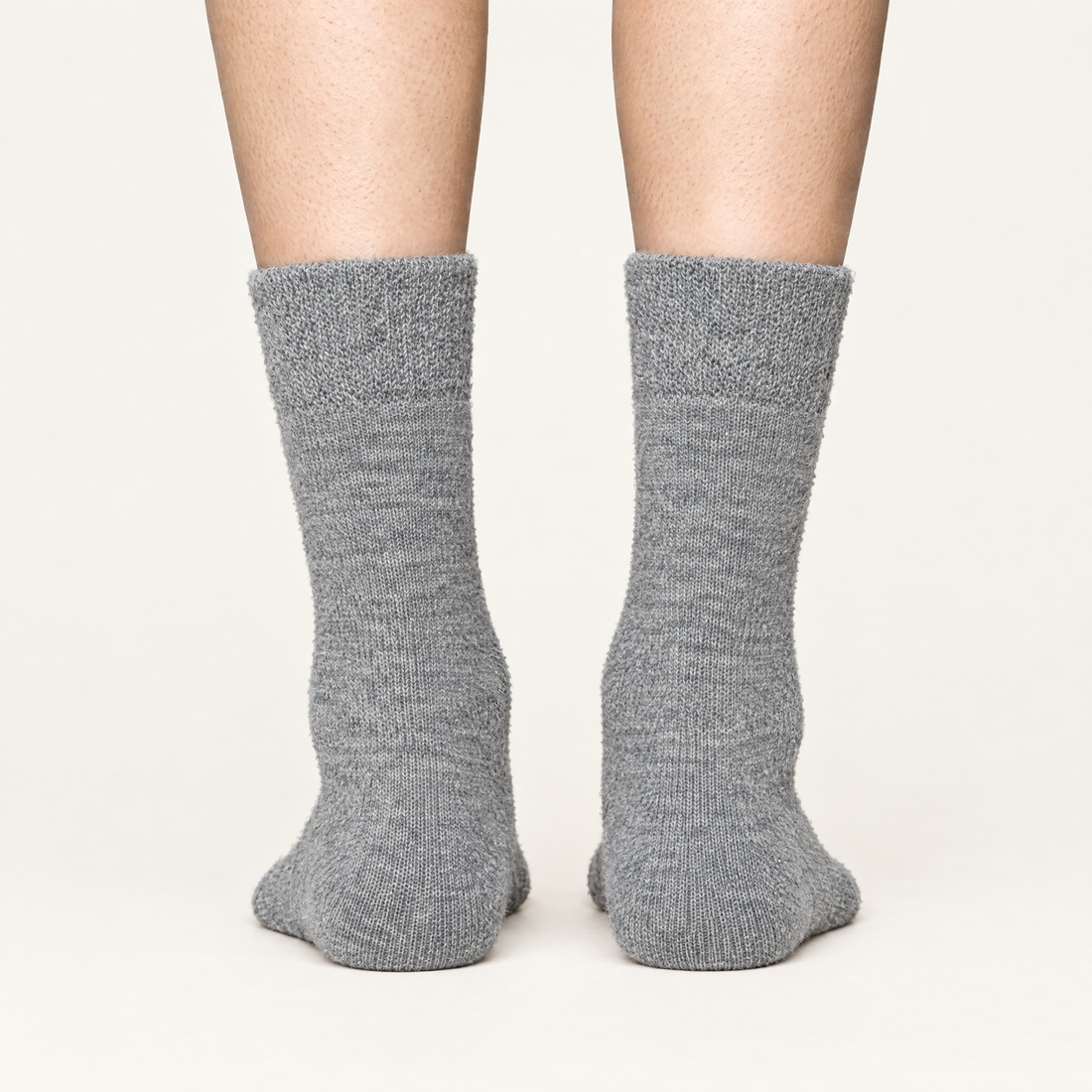 Grey alpaca hiker socks, back view of heels