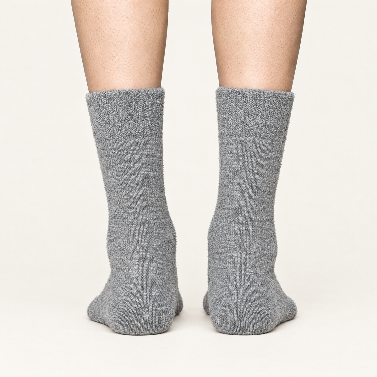 Grey alpaca hiker socks, back view of heels